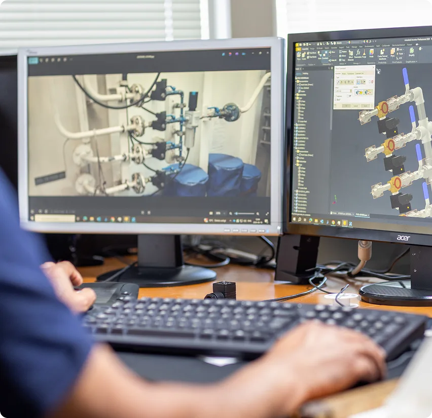 Two screen with industrial products. One with a CAD file and the other with a photograph