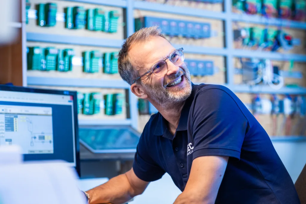man sitting in a technical room